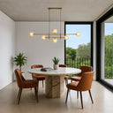 Elegant Tyson 6 Pendant Light with amber tear glass shades providing decorative lighting for cafés, restaurants, and boutique spaces.