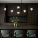 Contemporary Tyson 6 Pendant Light with black iron frame and frost tear glass shades for sophisticated ceiling lighting.