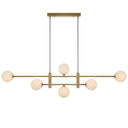 Close-up of the Tyson 6 Pendant Light highlighting interchangeable amber tear glass shades and antique gold metal finish.