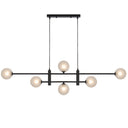 Tyson 6 Pendant Light installed above a kitchen island featuring a contemporary linear chandelier design with six decorative lights.