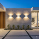Martec Taurus E27 Exterior Wall Light Modern outdoor setting with stone wall, decorative lights, and a glimpse into a home interior from Lights and Fans Online .