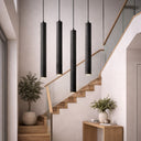 TORESS 80cm Charred Black Pendant Light Modern staircase with black pendant lights and decorative plants.