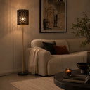 Luxury designer floor lamp styled in a boutique hotel lounge, blending contemporary elegance with warm atmospheric lighting.