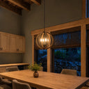 French Provincial sphere pendant light with four candle-style lights, adjustable chain suspension, and timeless dining room lighting.