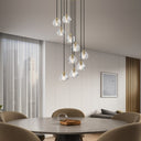 Luxury Zaha 10 pendant light with sparkling prismatic crystal spheres and antique gold frame for elegant stairwell lighting.