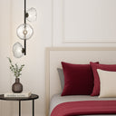 Contemporary vertical hanging light with frosted textured glass shades and premium lighting for stairwells, foyers, and open spaces.