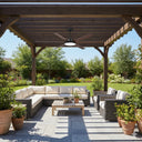 Large Martec  Cooling Fan with LED Light Outdoor patio with sectional sofa, coffee table, and potted plants under a wooden pergola presented by Lights and fans online.