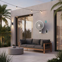 Outdoor patio with a modern sofa, coffee table, and wall-mounted air conditioner.