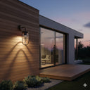 Martec Bronte E27 Exterior Wall Light Modern house exterior from lights and fans online  with a lit wall sconce and glass door reflecting the evening sky.