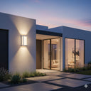 Martec Crew Tricolour LED Wall Light Modern house exterior with a light fixture and open door revealing from lights and fans online interior.