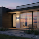 Integra 6W/10W Tricolour LED Up/Down Wall Light in a Modern house exterior with glass doors and a sunset view from Lights and Fans Online 
