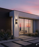 Kent 1LT Bronze from MDA Martec Modern house exterior with a sunset view through large glass doors.Lights and Fans Online 