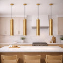 TORESS 50cm Aged Gold Leaf Pendant Light Modern kitchen with gold pendant lights and wooden chairs.